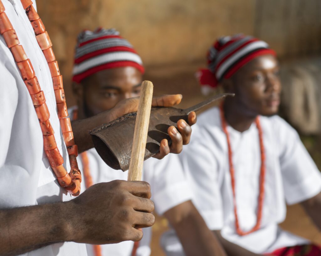 Close-up of hands playing a traditional wooden instrument