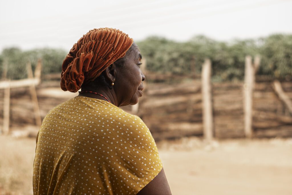Documentary portrait of an African elder outdoors