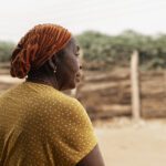 Documentary portrait of an African elder outdoors
